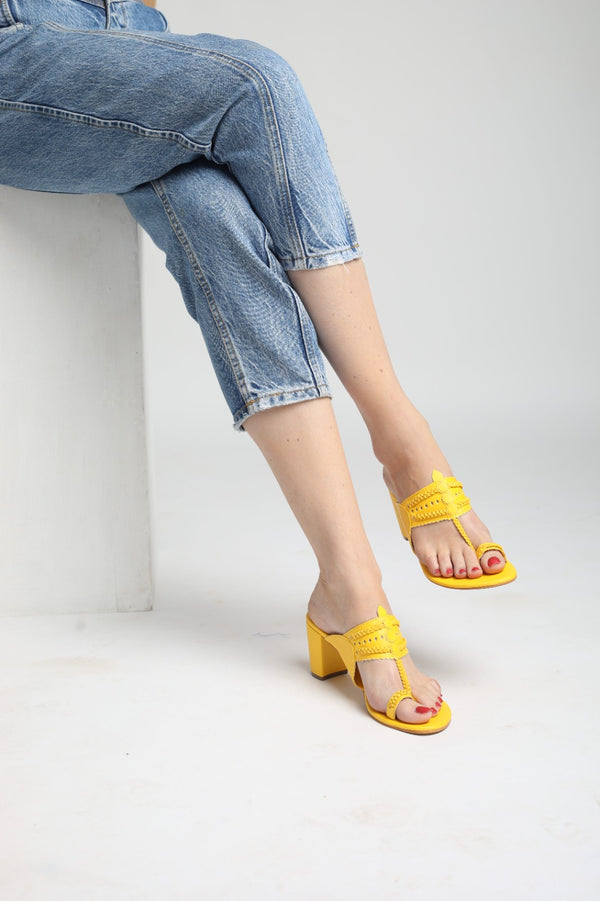 Yellow Heels. Block Heels, Yellow Block Heels, Party Heels, Traditional wear, Bright Yellow Heels, Koolhapuri Block Heels, SHIMUZZ Heels, Kolhapuri Heel, Girl wearing Blue Denim jeans with Yellow Block Heels