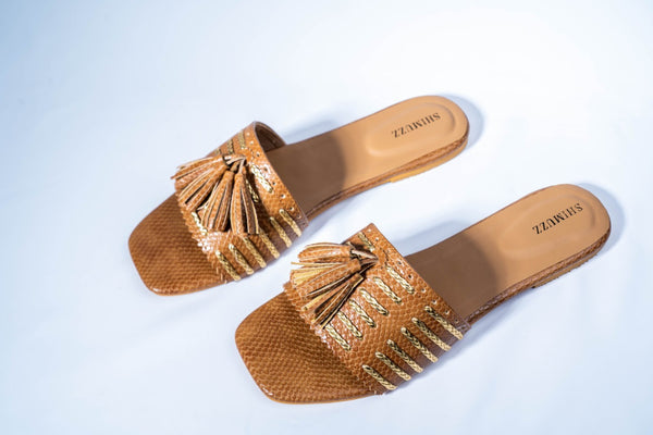 Tan sliders with tassel and golden braid
